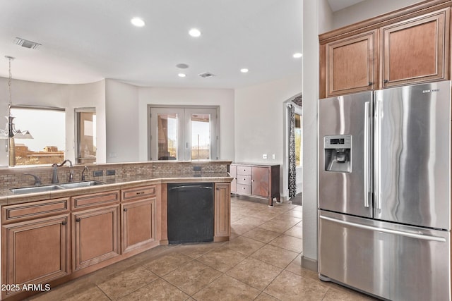 kitchen featuring pendant lighting, sink, tasteful backsplash, stainless steel fridge with ice dispenser, and light tile patterned floors