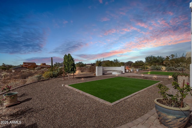 yard at dusk with a patio