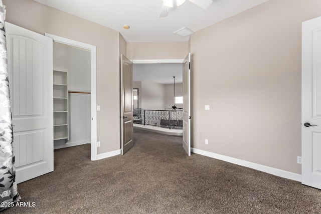 unfurnished bedroom with a closet, ceiling fan, and dark carpet