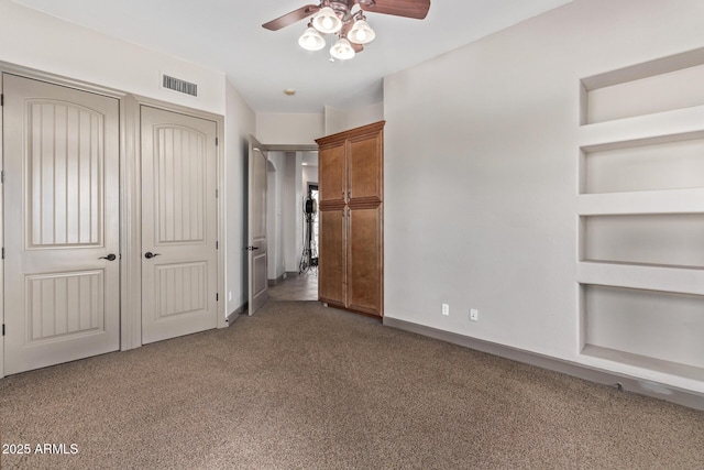 unfurnished bedroom with carpet flooring and ceiling fan