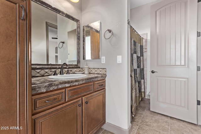 bathroom featuring vanity, tile patterned floors, walk in shower, and decorative backsplash