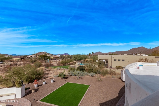 view of yard with a mountain view and a patio area