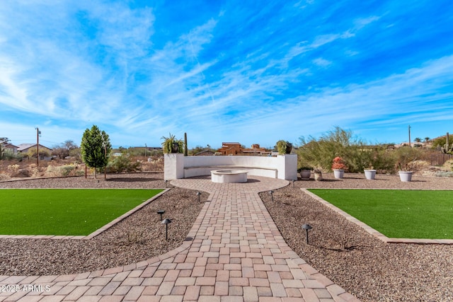 exterior space with a patio area and a fire pit