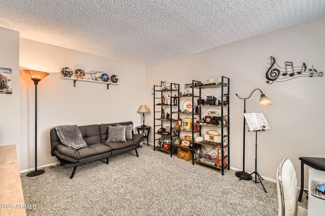 living area with baseboards, a textured ceiling, and carpet flooring
