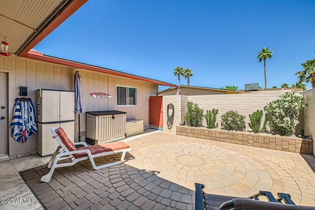 view of patio / terrace featuring central AC and fence private yard