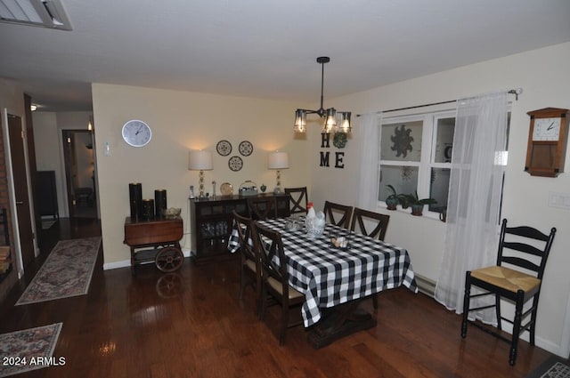dining space with wood finished floors and baseboards