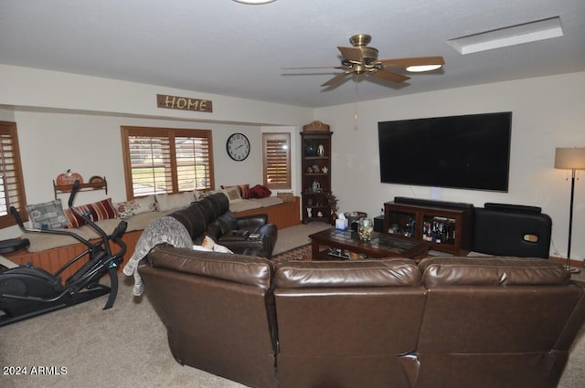living area with carpet flooring and a ceiling fan
