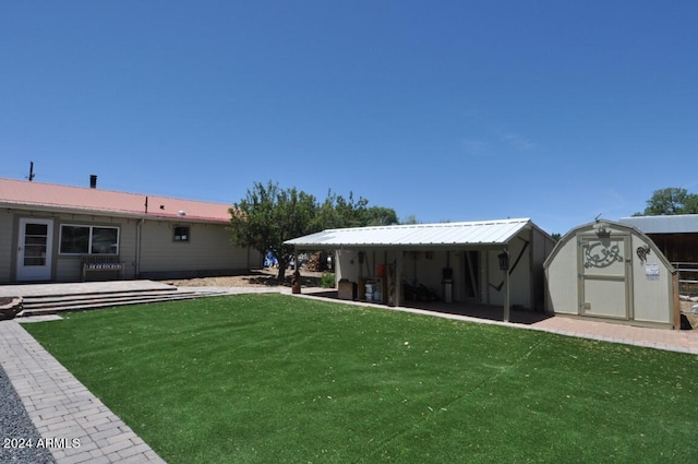 rear view of house with a storage shed, an outdoor structure, and a lawn