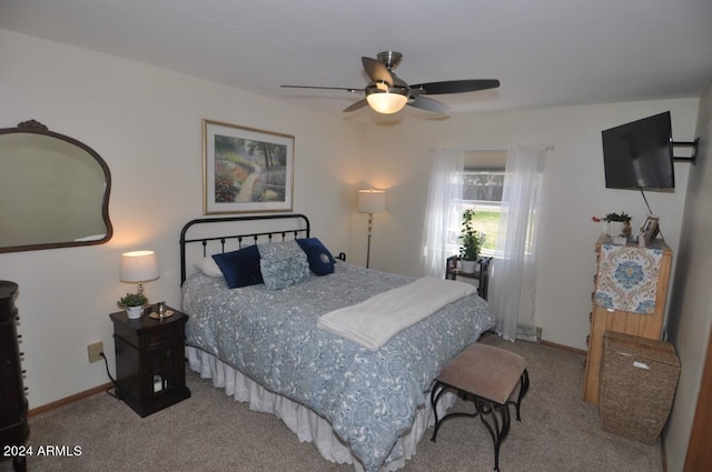 bedroom featuring carpet floors, baseboards, and a ceiling fan