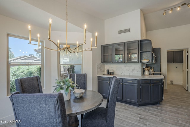 4248 E Jason Dr, Phoenix, AZ 85050 - dining area with a chandelier and light wood-type flooring