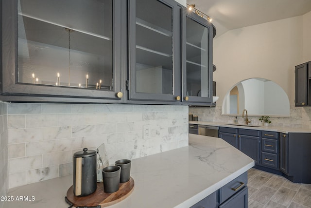 4248 E Jason Dr, Phoenix, AZ 85050 - kitchen featuring a sink, tasteful backsplash, blue cabinetry, and stainless steel dishwasher