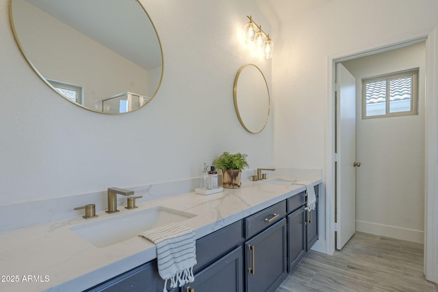 4248 E Jason Dr, Phoenix, AZ 85050 - full bath with double vanity, baseboards, and wood finished floors