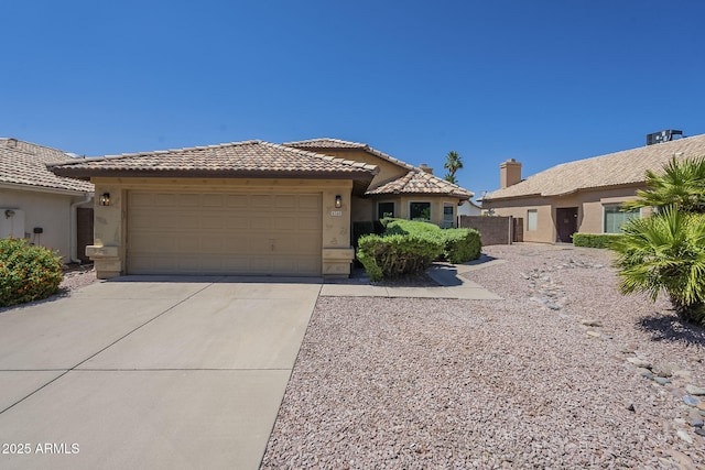 4248 E Jason Dr, Phoenix, AZ 85050 - view of front facade featuring stucco siding, an attached garage, driveway, and a tile roof