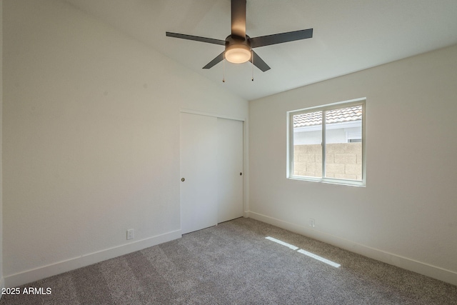 4248 E Jason Dr, Phoenix, AZ 85050 - unfurnished bedroom featuring carpet flooring, vaulted ceiling, a closet, baseboards, and ceiling fan