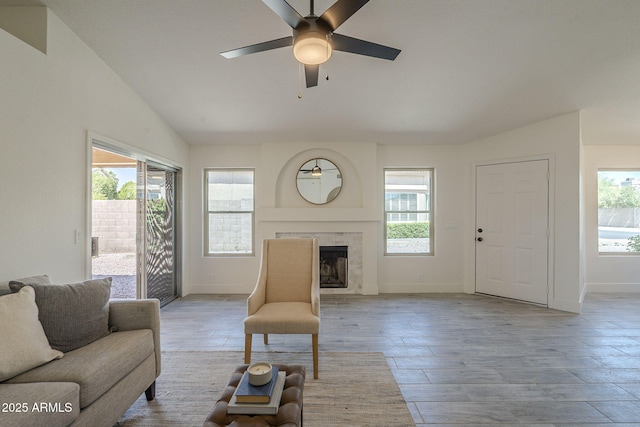 4248 E Jason Dr, Phoenix, AZ 85050 - living area featuring plenty of natural light, baseboards, a ceiling fan, a tile fireplace, and lofted ceiling
