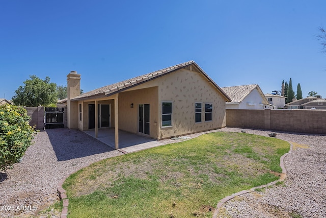 4248 E Jason Dr, Phoenix, AZ 85050 - rear view of property featuring a chimney, a patio area, stucco siding, and a tiled roof