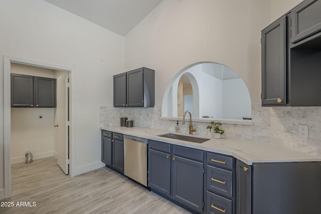4248 E Jason Dr, Phoenix, AZ 85050 - kitchen featuring dishwasher, a sink, backsplash, light wood-style floors, and baseboards