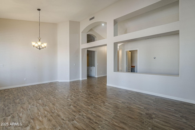 1826 W Oriole Way, Chandler, AZ 85286 - empty room with wood finished floors, a chandelier, and a towering ceiling