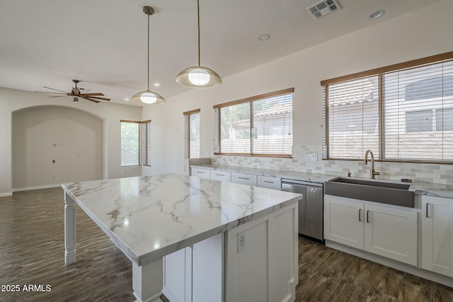 1826 W Oriole Way, Chandler, AZ 85286 - kitchen featuring dishwasher, dark wood-style flooring, tasteful backsplash, white cabinetry, and a kitchen island