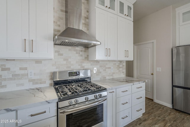1826 W Oriole Way, Chandler, AZ 85286 - kitchen featuring wall chimney range hood, stainless steel appliances, light stone counters, glass insert cabinets, and white cabinets