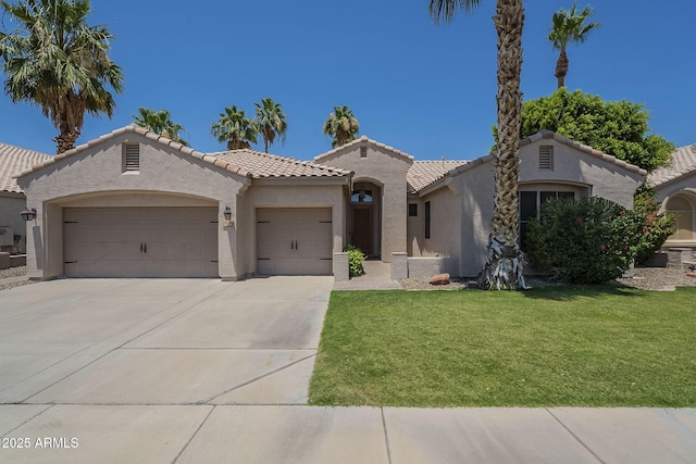 1826 W Oriole Way, Chandler, AZ 85286 - mediterranean / spanish-style home featuring a garage, stucco siding, a front yard, and driveway