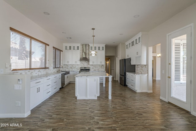 1826 W Oriole Way, Chandler, AZ 85286 - kitchen featuring wall chimney exhaust hood, appliances with stainless steel finishes, decorative backsplash, and white cabinetry