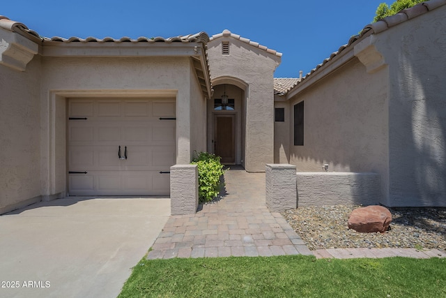 1826 W Oriole Way, Chandler, AZ 85286 - entrance to property featuring a tile roof, stucco siding, a garage, and concrete driveway