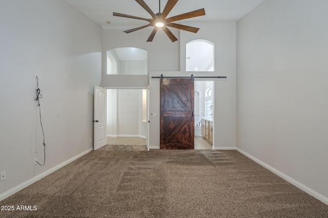 1826 W Oriole Way, Chandler, AZ 85286 - carpeted empty room featuring high vaulted ceiling, a ceiling fan, healthy amount of natural light, arched walkways, and a barn door