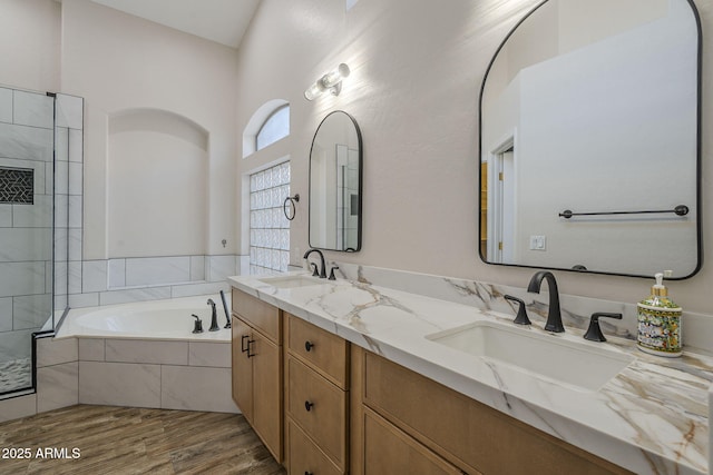 1826 W Oriole Way, Chandler, AZ 85286 - bathroom featuring a garden tub, double vanity, wood finished floors, and tiled shower