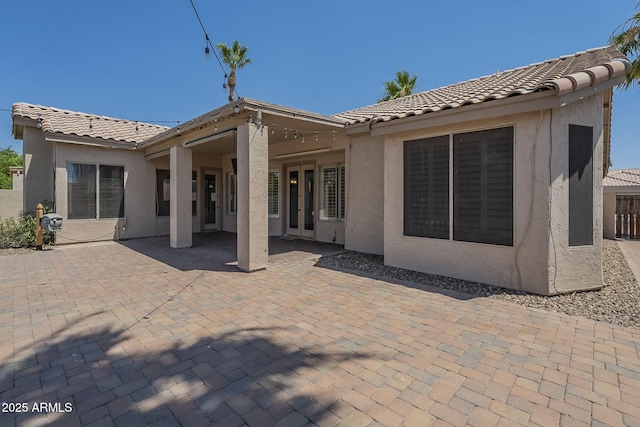 1826 W Oriole Way, Chandler, AZ 85286 - rear view of house featuring a tiled roof, stucco siding, and a patio area