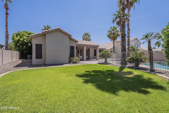 1826 W Oriole Way, Chandler, AZ 85286 - back of house with stucco siding, a fenced backyard, a patio area, and a tiled roof