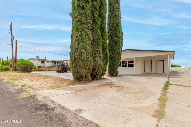 view of front of house featuring a carport