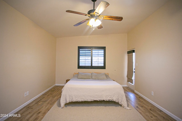 bedroom featuring hardwood / wood-style floors and ceiling fan