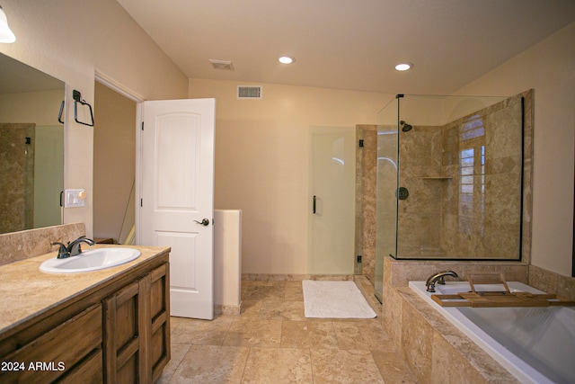 bathroom with vanity and plus walk in shower