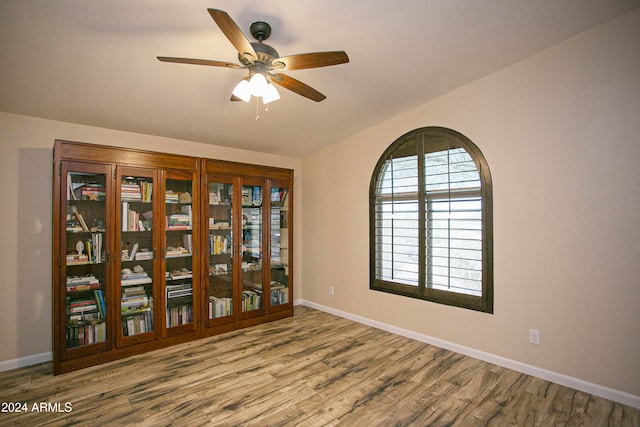 unfurnished room with vaulted ceiling, light wood-type flooring, and ceiling fan