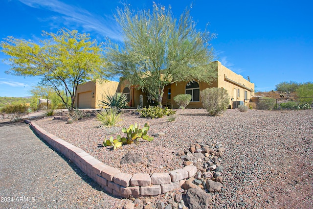 southwest-style home with a garage