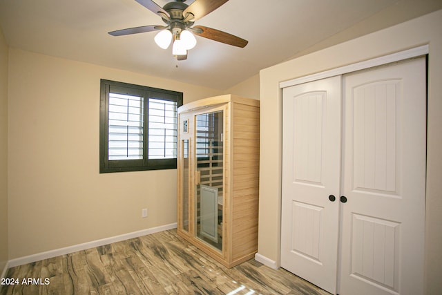 unfurnished bedroom with a closet, ceiling fan, and wood-type flooring