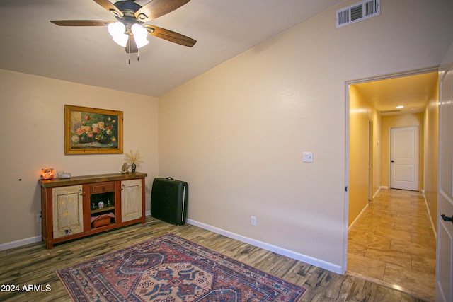 sitting room featuring hardwood / wood-style floors and ceiling fan