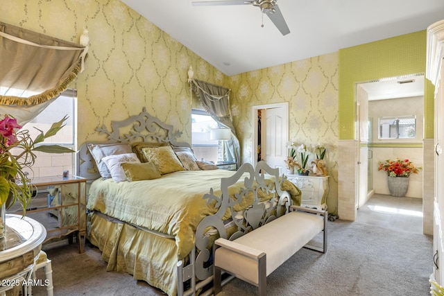 bedroom with ceiling fan, carpet flooring, visible vents, and wallpapered walls