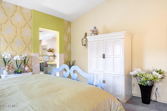 carpeted bedroom featuring baseboards and wallpapered walls