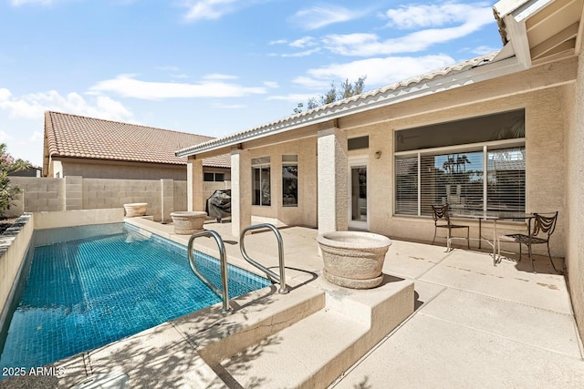 view of pool with a fenced in pool, a fenced backyard, and a patio