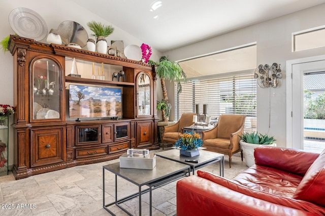 living area with vaulted ceiling