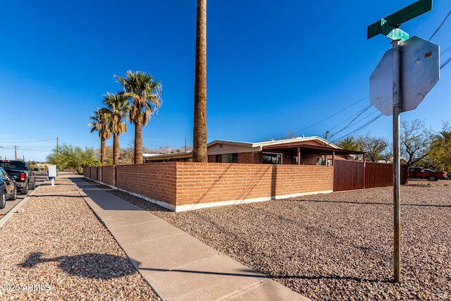 view of property exterior with fence