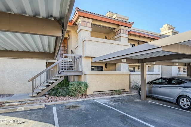 view of vehicle parking with a carport