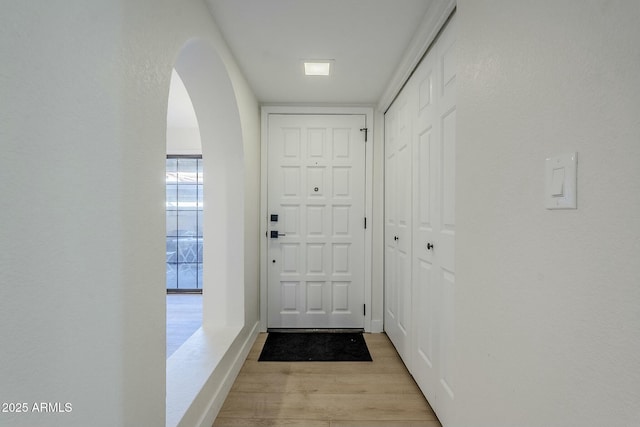 doorway to outside with light wood-type flooring