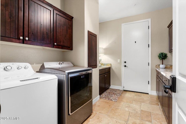 laundry area featuring cabinets and independent washer and dryer