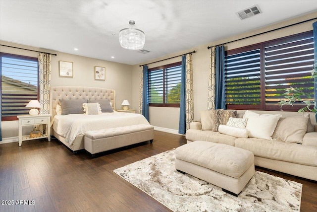 bedroom with dark wood-type flooring