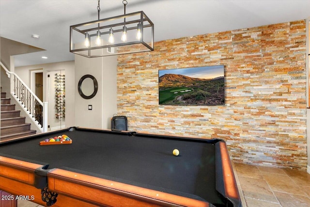 game room with billiards and stone tile flooring