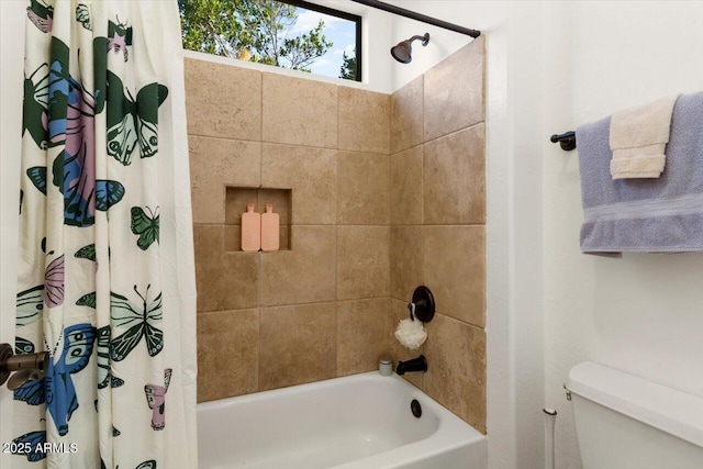 bathroom featuring shower / bath combo and toilet