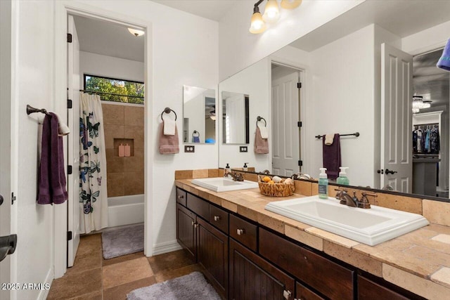 bathroom with vanity and shower / tub combo